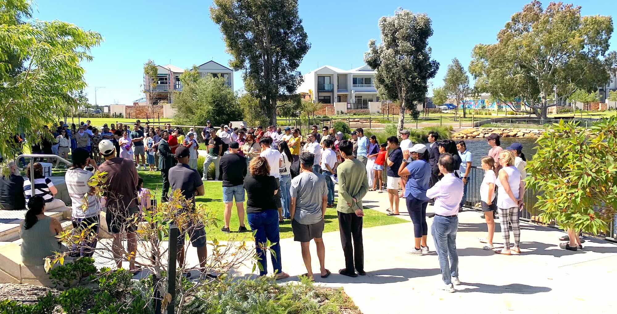 lake treeby land auction 2110 group of people houses grass